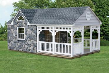 AFrame Guest House with dormer, stone vernier siding and porch