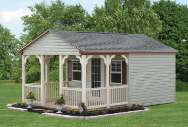guest/ pool house with vinyl siding and porch..