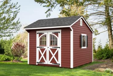Quaker Shed with LP Lap Siding painted red with white trim, carriage doors and shutters