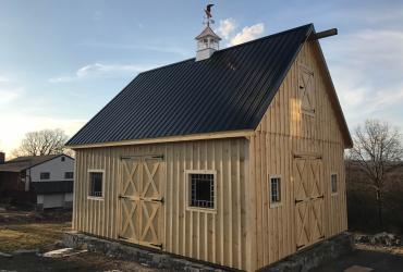 Custom Board and Batten Barn with cupola and weathervane