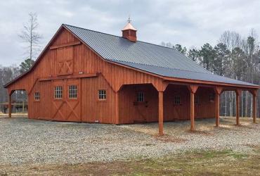 Two story modular barn with loft and overhangs