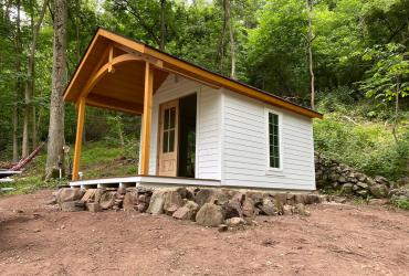 a custom cottage in the heritage cabin style.