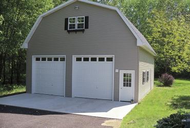 front of 2-story 2-door custom gambrel garage.