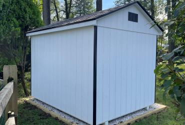 rear view of white shed with black trim