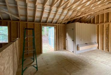 interior of shed showcasing open space and doorway