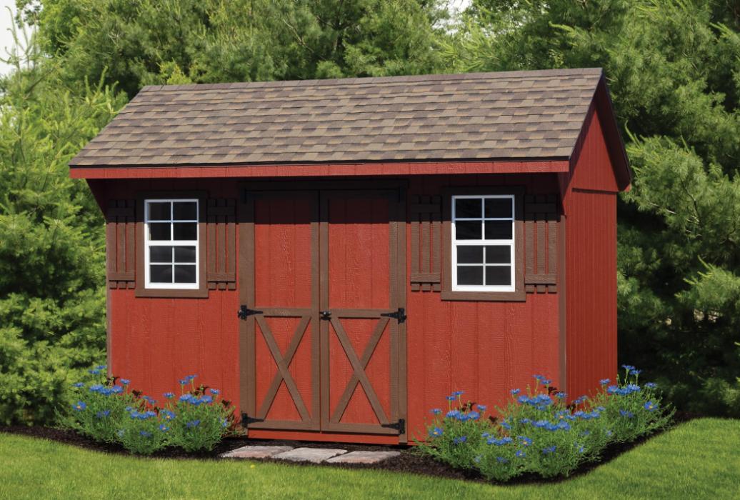Quaker T-11 Brown Trim Red Siding quaker shed with t1-11 siding painted red and with brown trim.