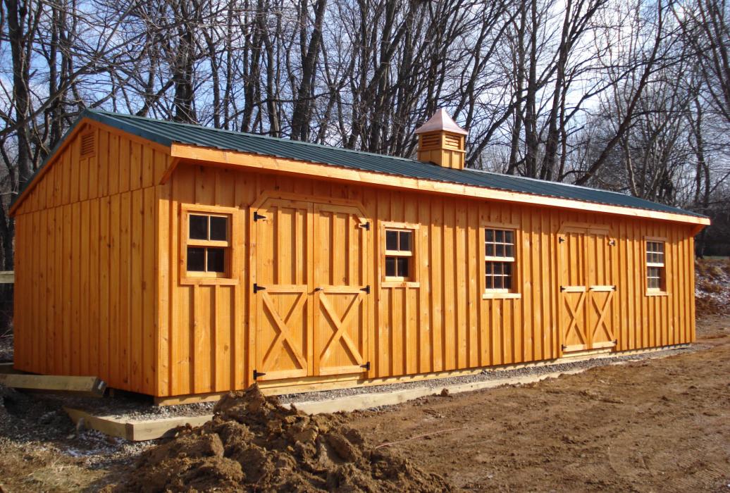 Quaker Board and Batten Standard Shed with optional wood windows, cupola, and end vents.