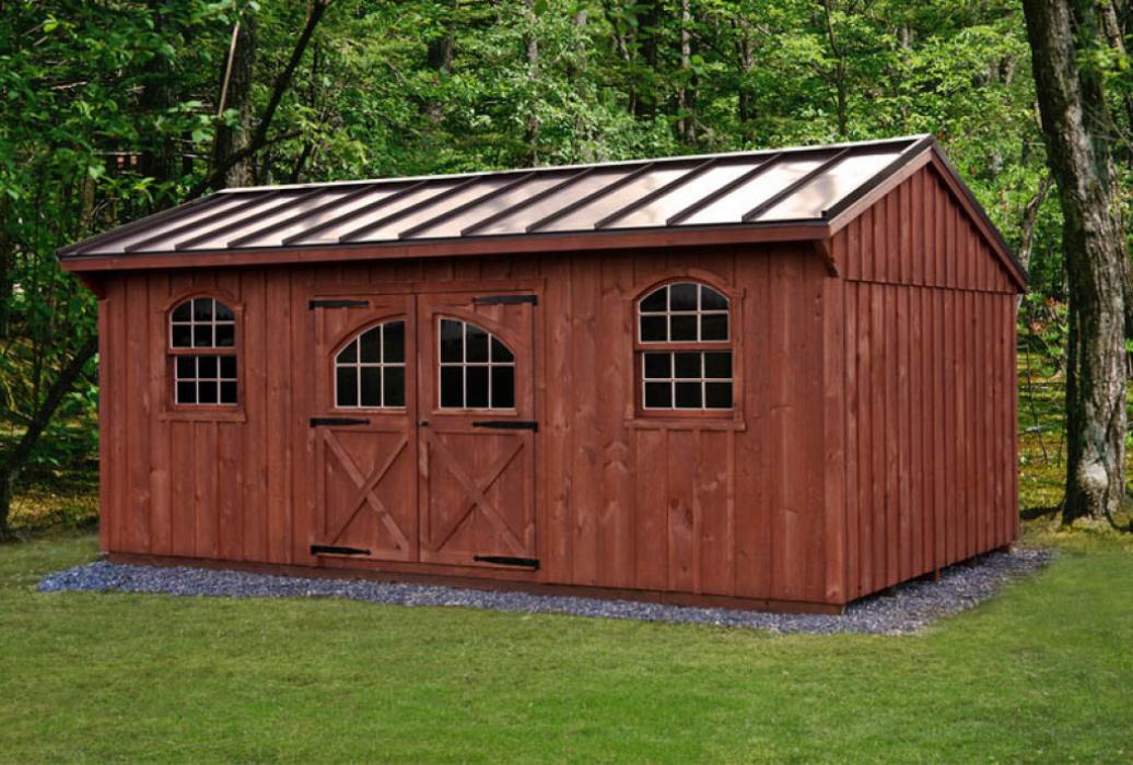 Quaker Board and Batten Standard Shed with rustic cedar stain, arched top windows and carriage doors.