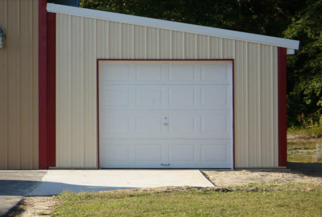 Lean-to single-car garage with metal siding