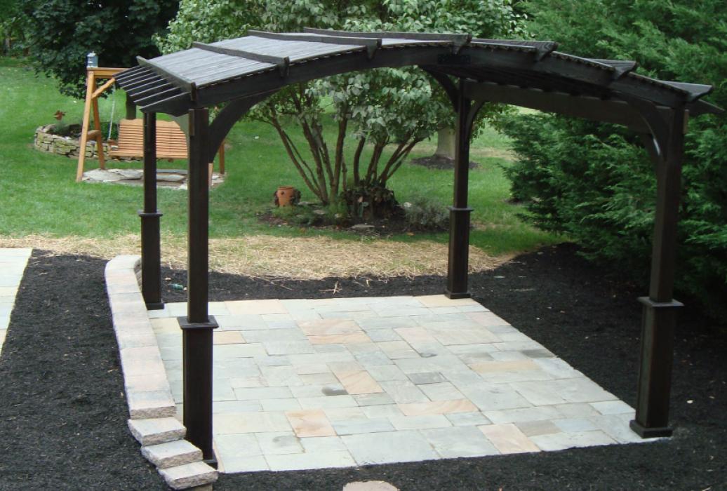 cozy arched cinder stained wood pergola