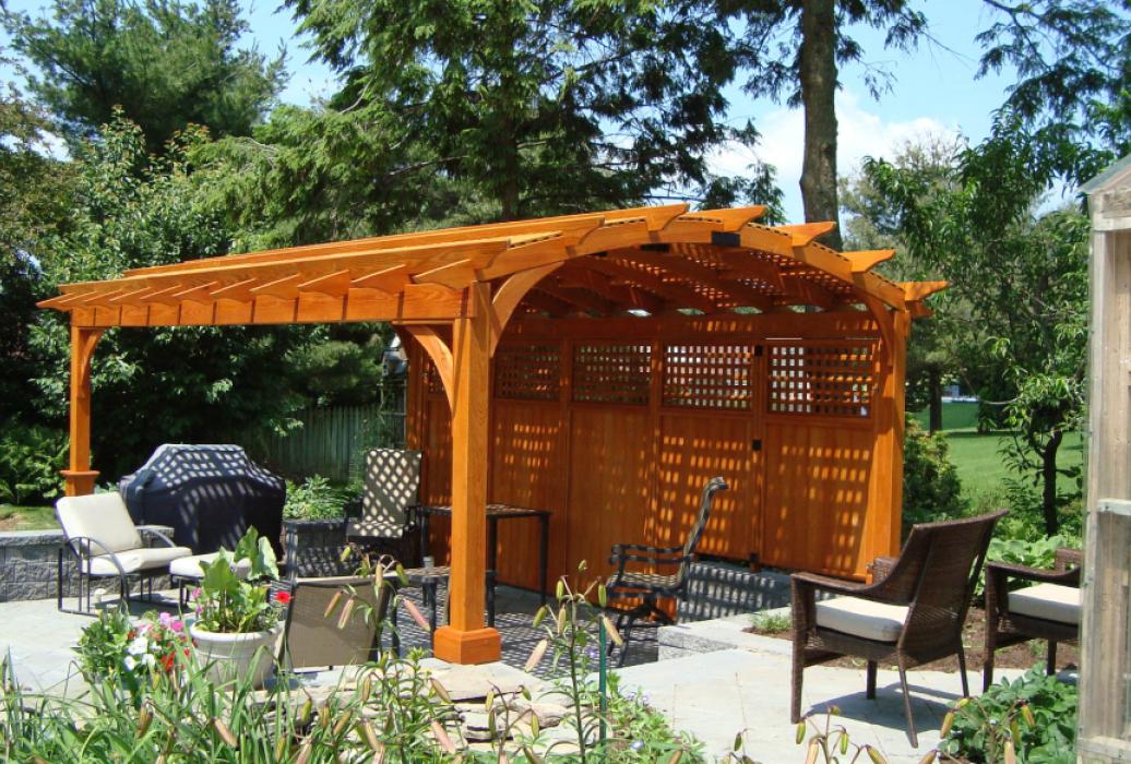 cozy arched cedar stained wood pergola