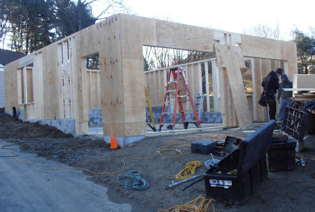 GALLERY 25-1 two story a frame garage shown being constructed