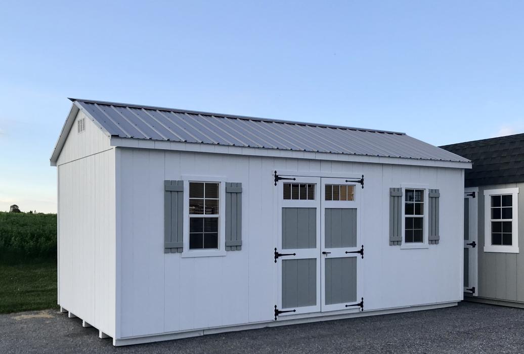 Taller walls-metal roof -classic doors with transom-three slat shutters-wider window trim