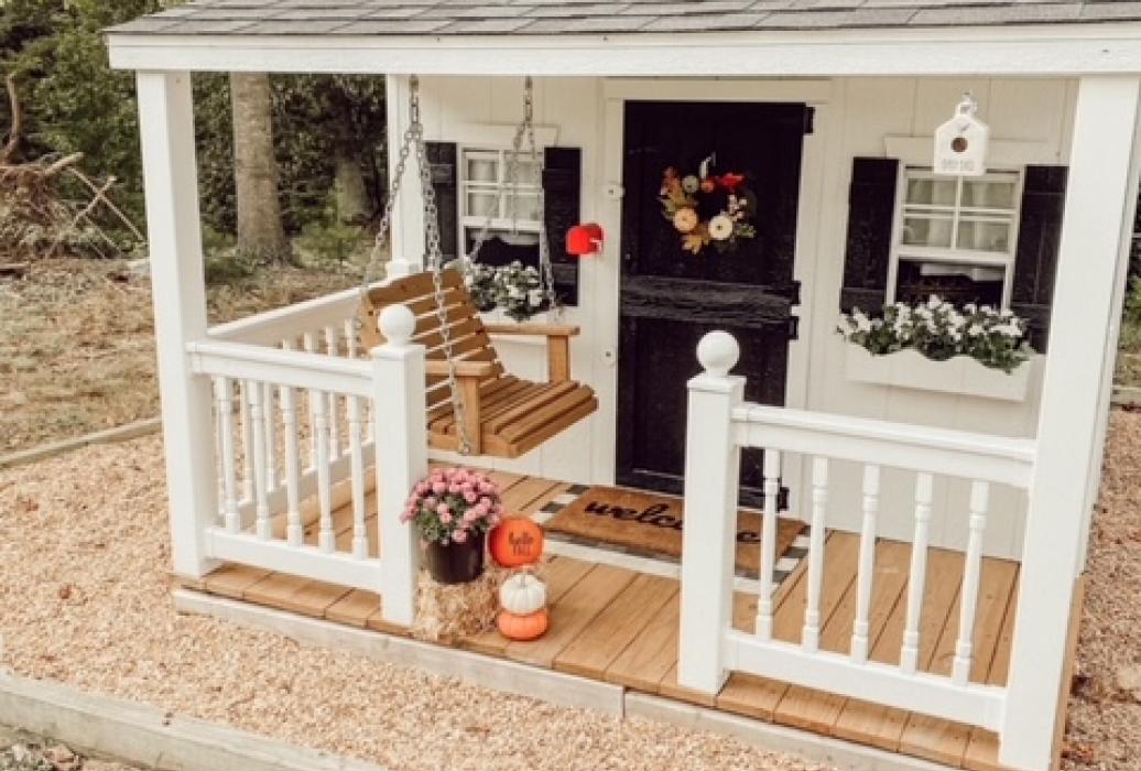 Wooden playhouse shop with porch