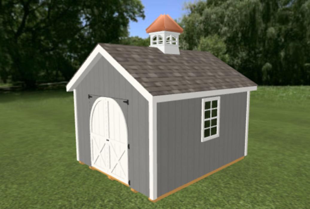 A small shed on grass with custom cupola and gray siding