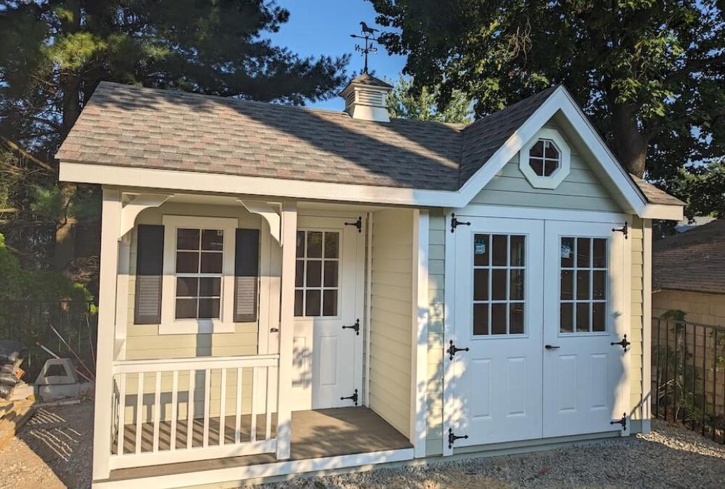 Tan shed with front porch