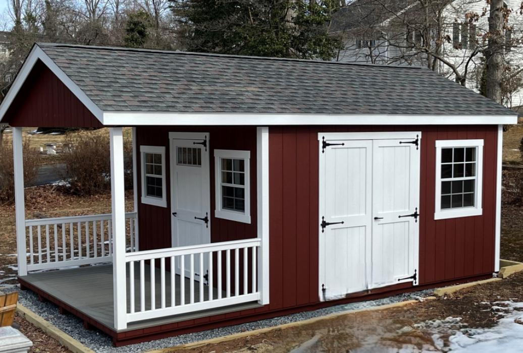 Red storage shed with porch