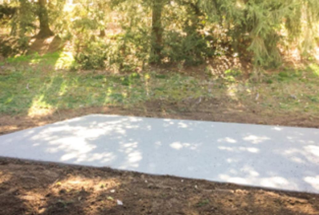 Concrete pad foundation for a shed