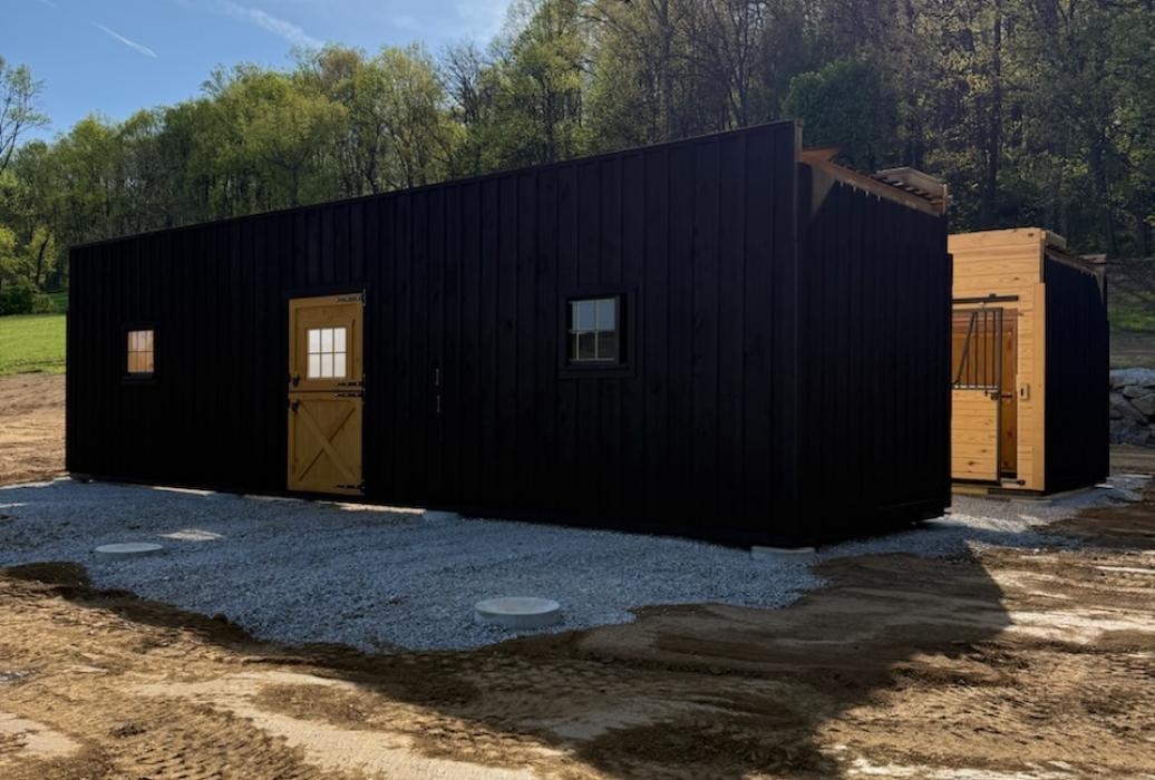 Modular barn set before halves are joined and roof is built.