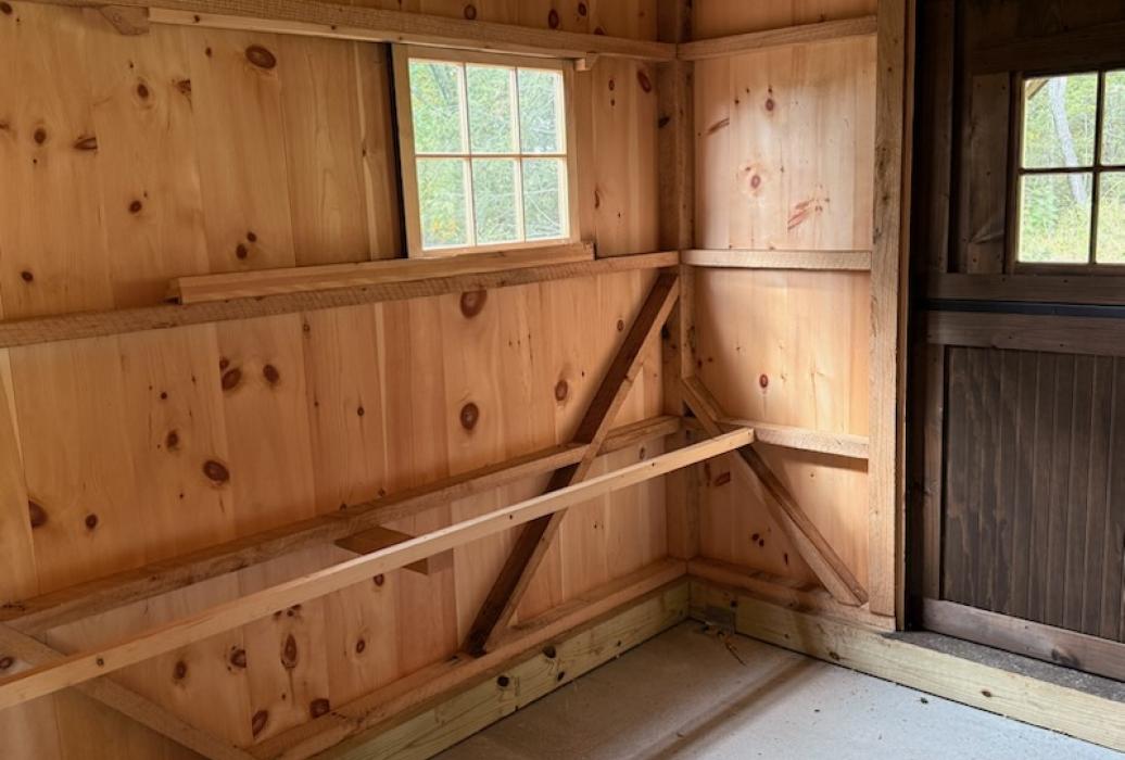 Large barn stall section used as a chicken coop -roost
