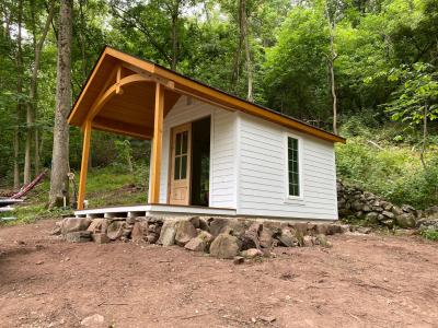 a custom cottage in the heritage cabin style.