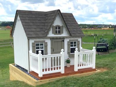 side view of small playhouse with min deck.