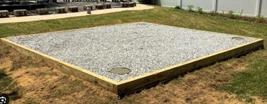 Gravel foundation with lumber perimeter