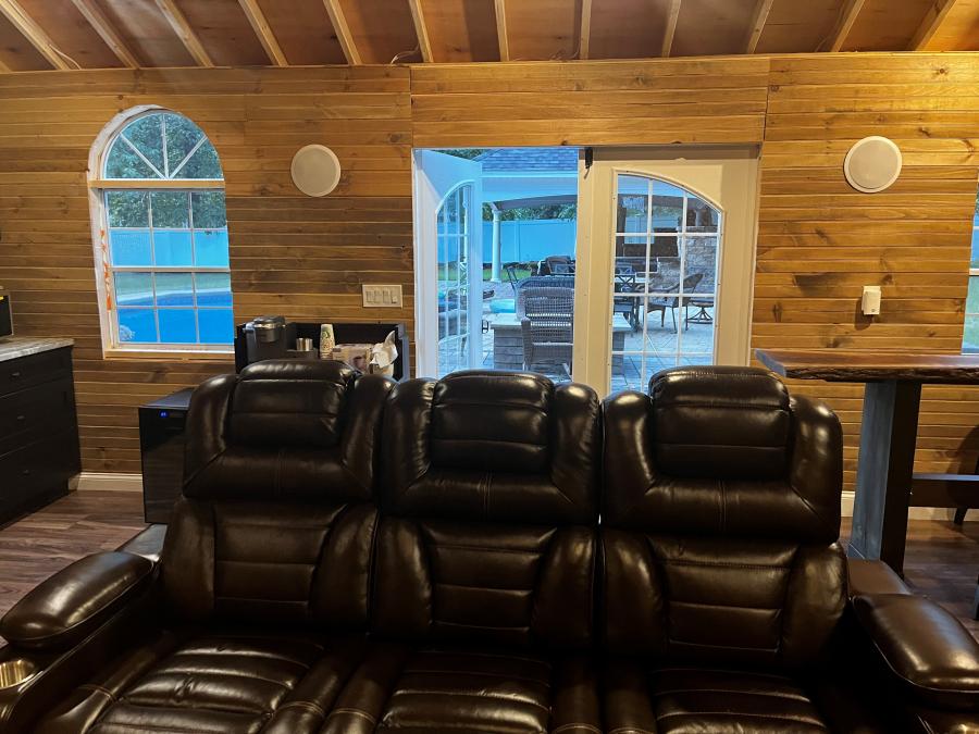 interior of man cave with couch and coffee bar