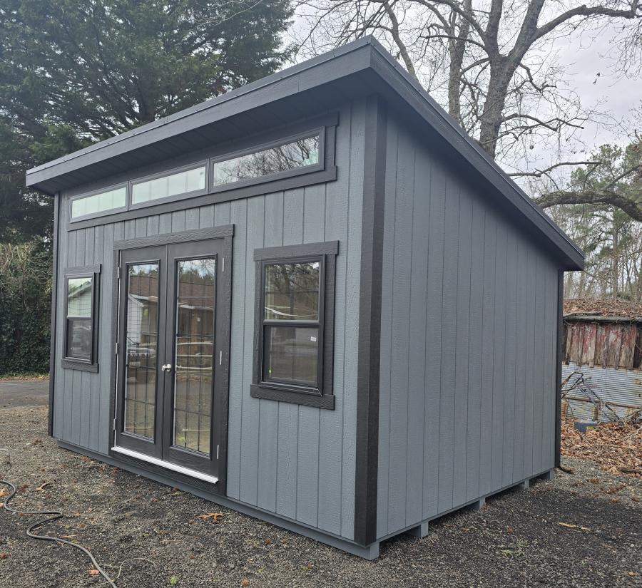 gray studio office shed with t1-11 siding